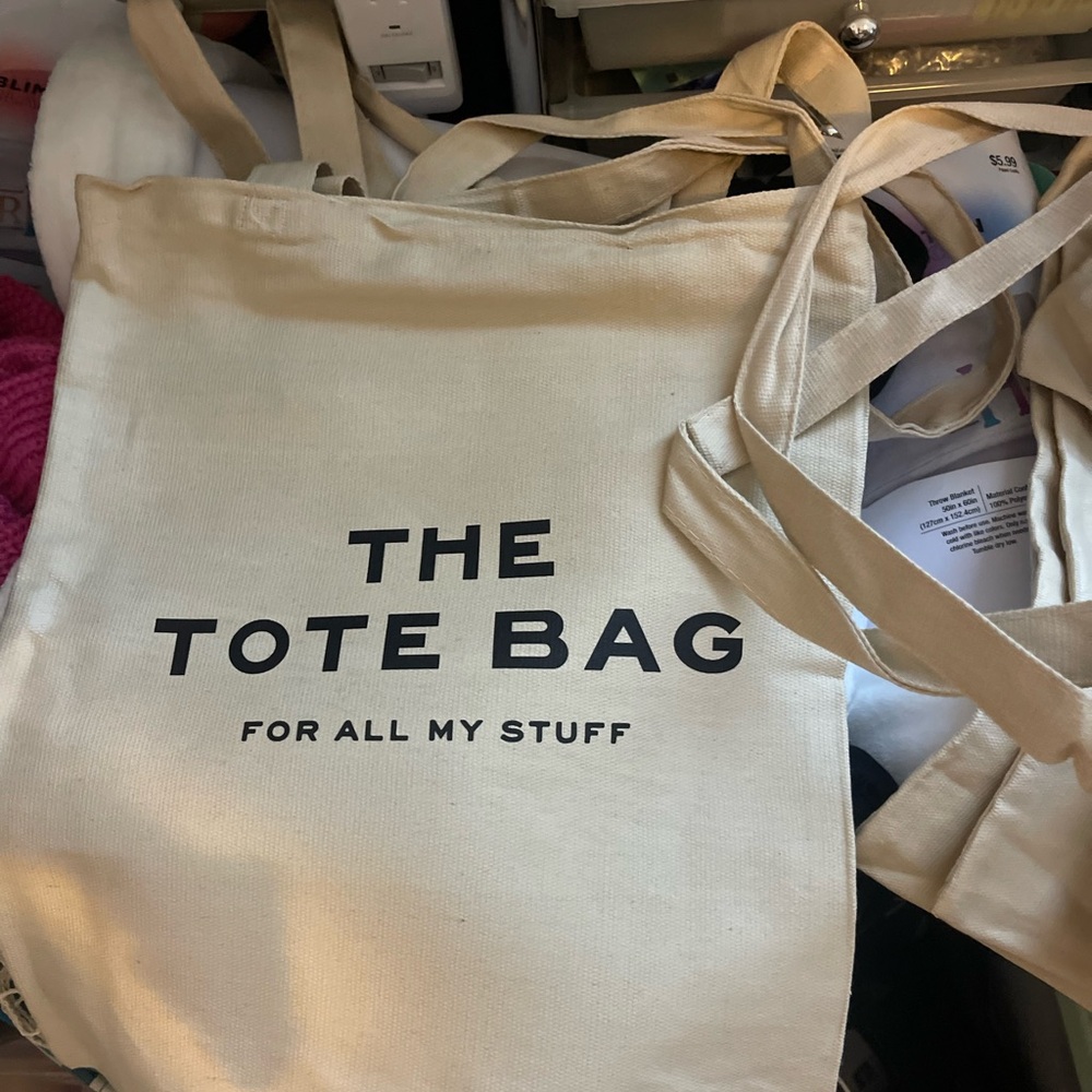 Beige Tote Bag with Black Text